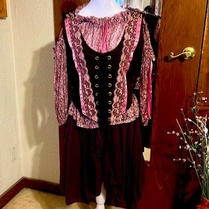 Renaissance style skirt, sheer blouse and corseted vest.